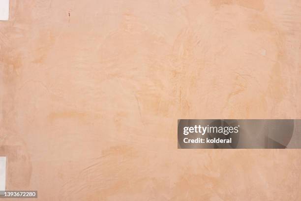 light orange colored plastered textured wall, full frame - creme textur bildbanksfoton och bilder
