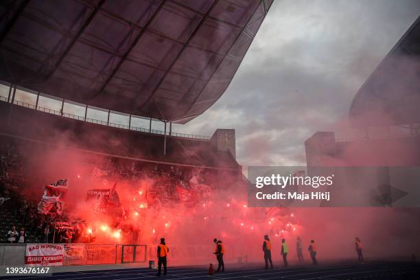 Ultra fans of VfB Stuttgart light flares and smoke flares prior to kick off of the Bundesliga match between Hertha BSC and VfB Stuttgart at...