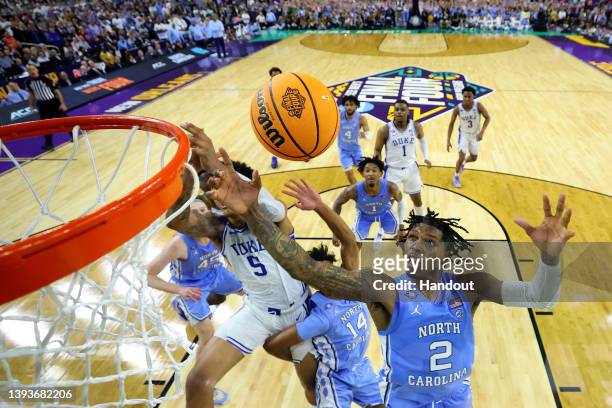 Caleb Love of the North Carolina Tar Heels grabs a rebound against the Duke Blue Devils during the second half in the semifinal game of the 2022 NCAA...