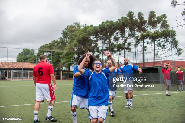 soccer players celebrating goal - including trans player - transgender athlete stock pictures, royalty-free photos & images