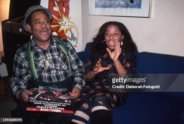 Deborah Feingold/Corbis via Getty Images) American Jazz musician Dizzy Gillespie and Pop and R&B singer Chaka Khan sit together on a couch during a...