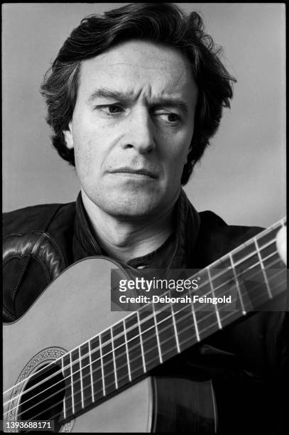 Deborah Feingold/Corbis via Getty Images) Close-up of English Jazz musician John McLaughlin as he plays an acoustic guitar, New York, New York, 1981.