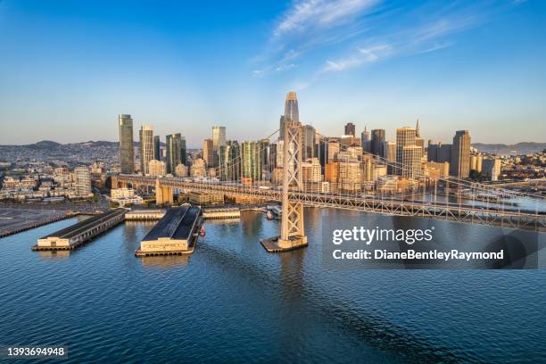 aerial view of san francisco skyline and bay bridge - san francisco bay stock pictures, royalty-free photos & images