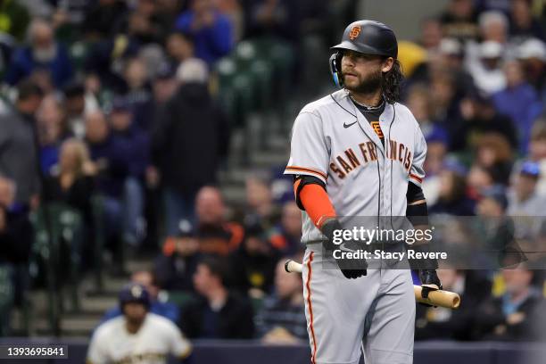 Brandon Crawford of the San Francisco Giants reacts to a strike out during the first inning against the Milwaukee Brewers at American Family Field on...