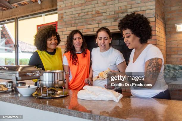 women having barbecue after soccer game - garlic bread stock pictures, royalty-free photos & images