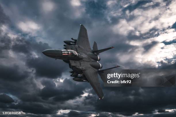 jet fighters flying over the clouds. - fighter plane imagens e fotografias de stock