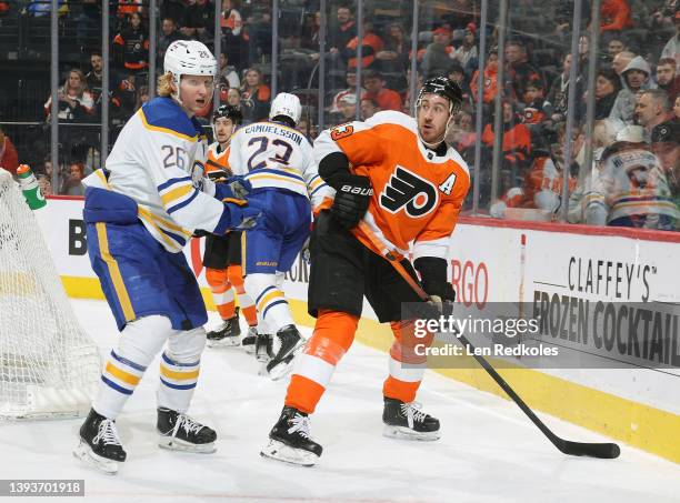 Kevin Hayes of the Philadelphia Flyers skates behind the net against Rasmus Dahlin of the Buffalo Sabres at the Wells Fargo Center on April 17, 2022...