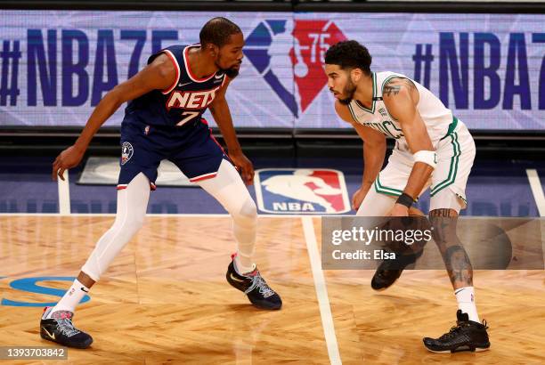 Kevin Durant of the Brooklyn Nets and Jayson Tatum of the Boston Celtics square off during the first quarter of Game Four of the Eastern Conference...