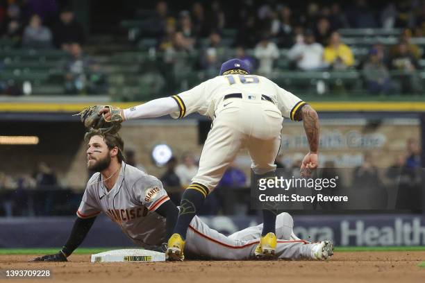 Luis Gonzalez of the San Francisco Giants is tagged out at second base by Kolten Wong of the Milwaukee Brewers during the seventh inning at American...
