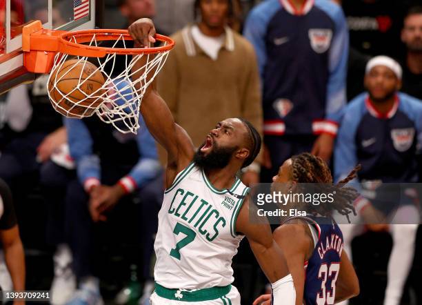 Jaylen Brown of the Boston Celtics dunks as Nic Claxton of the Brooklyn Nets defends in the first half during Game Four of the Eastern Conference...