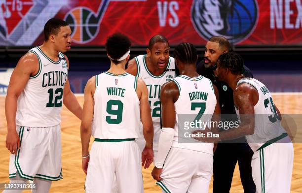 Grant Williams,Derrick White,Al Horford, Jaylen Brown, Marcus Smart and head coach Ime Udoka of the Boston Celtics huddle in the final minutes during...