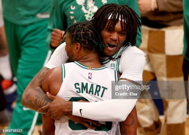 Robert Williams III of the Boston Celtics celebrates with Marcus Smart in the final minutes of the Game Four of the Eastern Conference First Round...