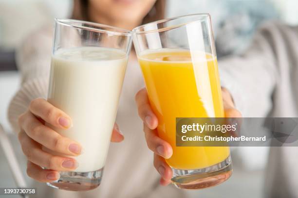 breakfast cheers - orange juice stockfoto's en -beelden