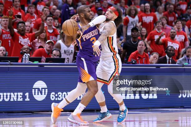 Chris Paul of the Phoenix Suns drives against Jose Alvarado of the New Orleans Pelicans during Game Four of the Western Conference First Round NBA...