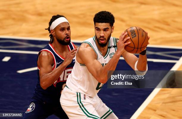 Jayson Tatum of the Boston Celtics tries to get past Patty Mills of the Brooklyn Nets during Game Four of the Eastern Conference First Round Playoffs...