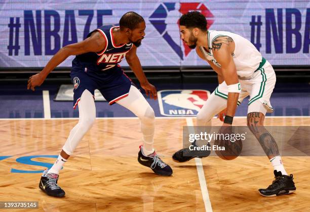 Kevin Durant of the Brooklyn Nets and Jayson Tatum of the Boston Celtics square off during the first quarter of Game Four of the Eastern Conference...