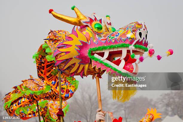 traditional chinese dragon dancing - chinesischer drache stock-fotos und bilder