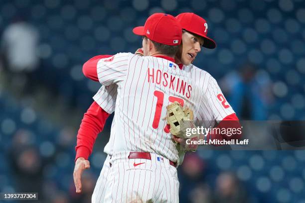 Rhys Hoskins of the Philadelphia Phillies hugs Alec Bohm against the Colorado Rockies at Citizens Bank Park on April 25, 2022 in Philadelphia,...