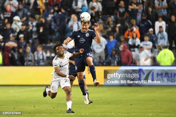 Roger Espinoza of Sporting Kansas City wins the header during a game between Columbus Crew and Sporting Kansas City at Children's Mercy Park on April...