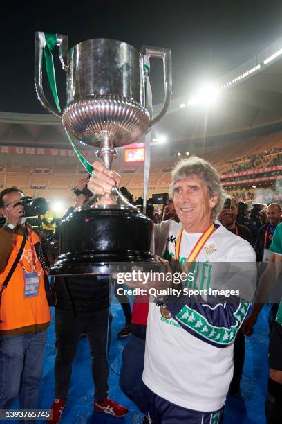 Manuel Pellegrini, Manager of Real Betis celebrates victory with the Copa del Rey trophy after the Copa del Rey final match between Real Betis and...