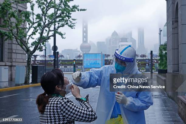 Residents queue up for COVID-19 nucleic acid tests on the Fuzhou road during the phased lockdown triggered by the COVID-19 outbreak on April 26, 2022...
