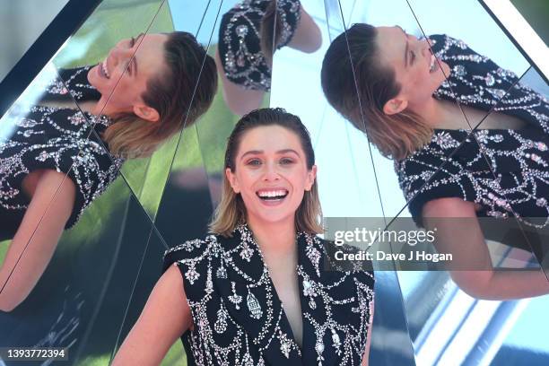 Elizabeth Olsen attends the Doctor Strange In The Multiverse Of Madness photocall at Trafalgar Sq on April 26, 2022 in London, England.