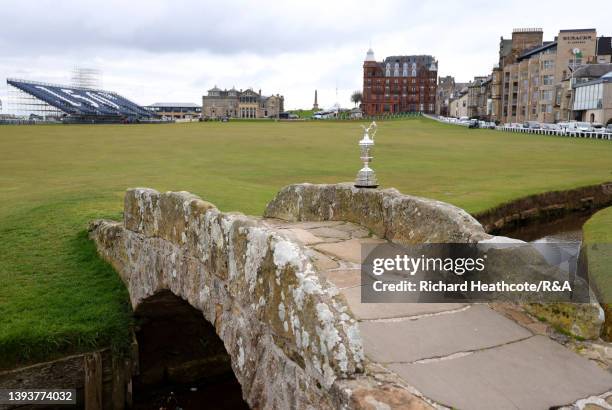 The Claret Jug sits on the The Swilcan Bridge at St Andrews Old Course on April 26, 2022 in St Andrews, Scotland. The 150th Open Championship will...