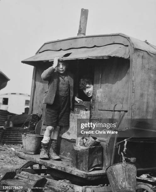 Roma people in their caravan, who have been served with an eviction notice by the British Council, at a camp on Belvedere Marsh in London, England,...