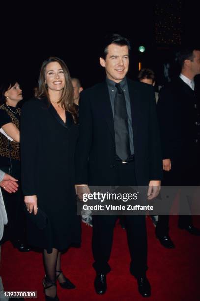 American journalist Keely Shaye Smith and her partner, Irish actor Pierce Brosnan attend the Universal City premiere of 'Dante's Peak,' held at the...