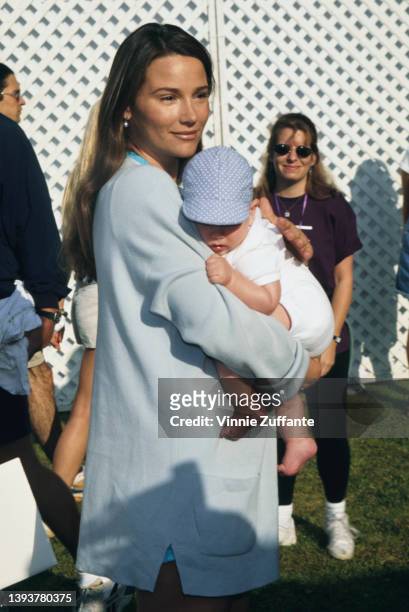 American journalist Keely Shaye Smith holding her son, Dylan Thomas Brosnan, attends the 4th Annual Revlon Run/Walk for Breast Cancer Research at...