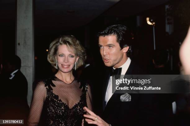 Australian actress Cassandra Harris and her husband, Irish actor Pierce Brosnan attend the 42nd Golden Globe Awards, held at the Beverly Hilton Hotel...