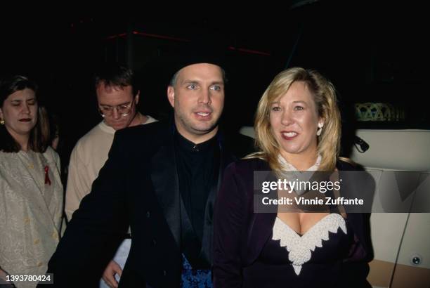 American singer and songwriter Garth Brooks and his wife, American songwriter Sandy Mahl attend the 23rd Annual American Music Awards, held at the...