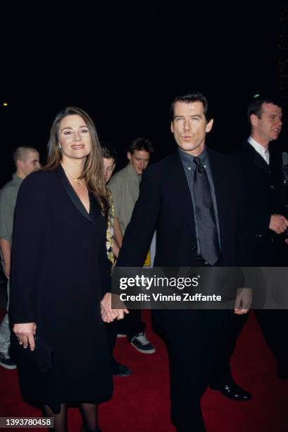 American journalist Keely Shaye Smith and her partner, Irish actor Pierce Brosnan attend the Universal City premiere of 'Dante's Peak,' held at the...