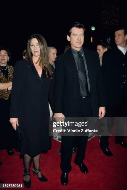 American journalist Keely Shaye Smith and her partner, Irish actor Pierce Brosnan attend the Universal City premiere of 'Dante's Peak,' held at the...