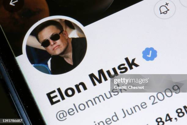 In this photo illustration, the Elon Musk’s Twitter account is displayed on the screen of an iPhone on April 26, 2022 in Paris, France. The U.S....