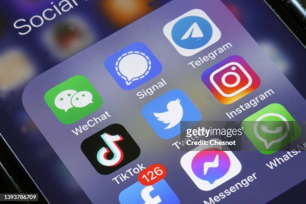 In this photo illustration, the logos of social media applications, Instagram, WhatsApp, Messenger, WeChat, Signal, Telegram, TikTok, Twitter and...