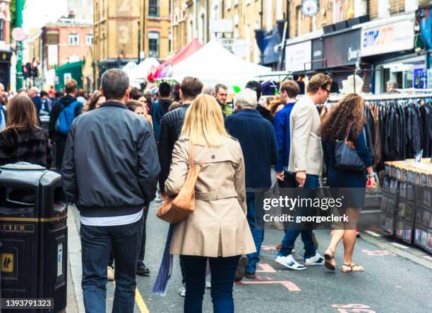 visiting street market on brick lane in london - hackney weekend stock pictures, royalty-free photos & images