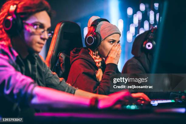 the young girl is dissapointed because she lost the game - gaming championship stock pictures, royalty-free photos & images