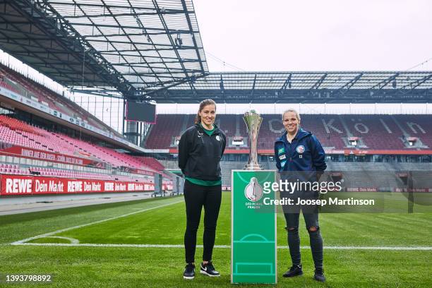 Lisa Weiß of VfL Wolfsburg and Isabel Kerschowski of 1. FFC Turbine Potsdam pose with the trophy during Women's DFB Cup Final - Finalists Talk at...