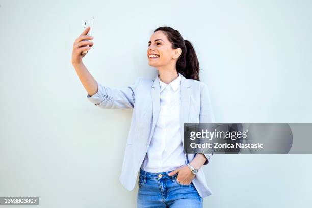 beautiful girl taking selfie - taking selfie white background stock pictures, royalty-free photos & images