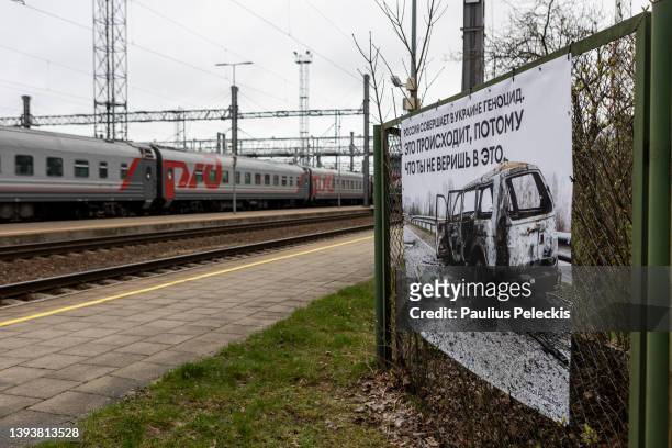 Photograph by Ukrainian photographer Mikhail Palinchak of Russia's war in Ukraine are displayed as part of an exhibition at the railway station where...