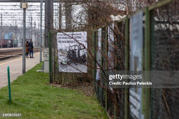 Photograph by Ukrainian photographer Mikhail Palinchak of Russia's war in Ukraine are displayed as part of an exhibition at the railway station where...