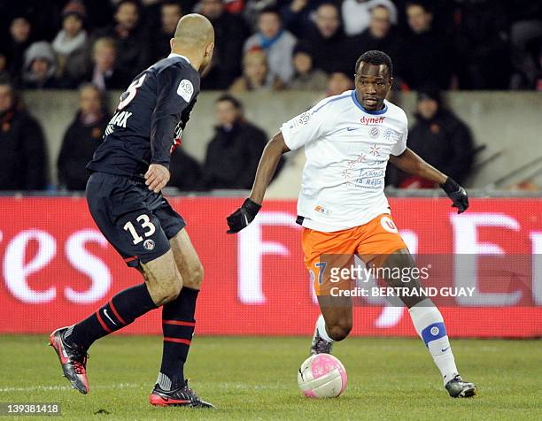 Montpellier's player John Chukwudi Utaka vies with Paris Saint-Germain's defender Alex Rodrigo Dias Da Costa during the French L1 football match...