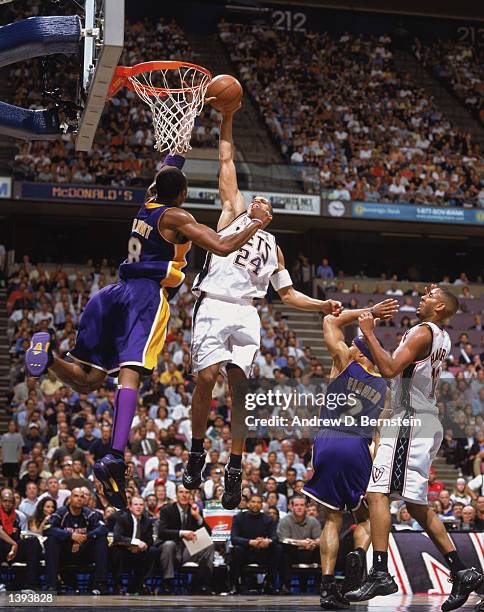 Forward Richard Jefferson of the New Jersey Nets dunks over guard Kobe Bryant of the Los Angeles Lakers during Game Four of the 2002 NBA Finals at...