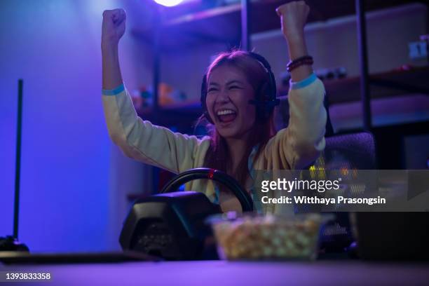 woman wins video game of online racing. - turnover sport stock pictures, royalty-free photos & images