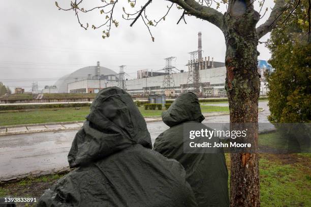 Ukrainian army soldiers stand guard at the Chernobyl Nuclear Power Plant on April 26, 2022 in Chernobyl, Ukraine. Staff from the International Atomic...