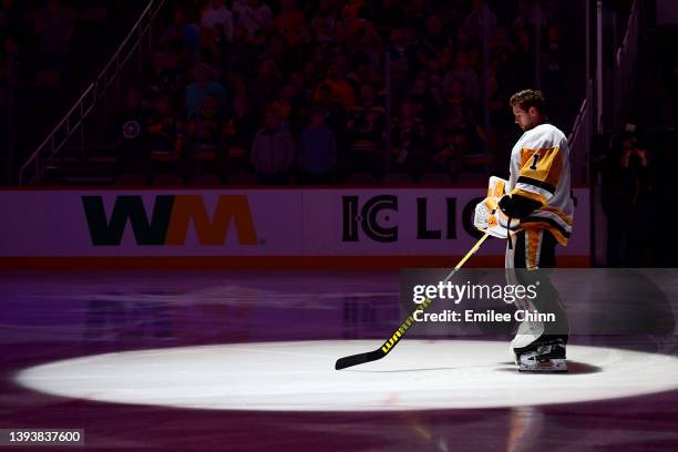 Casey DeSmith of the Pittsburgh Penguins stands for the national anthem before a game between the Pittsburgh Penguins and Boston Bruins at PPG PAINTS...