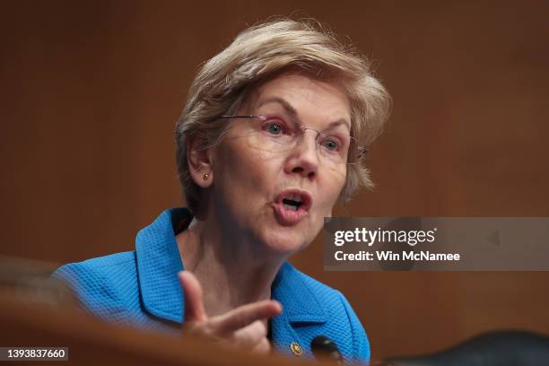 Sen. Elizabeth Warren questions Consumer Financial Protection Bureau Director Rohit Chopra as he testifies before the Senate Banking, Housing and...