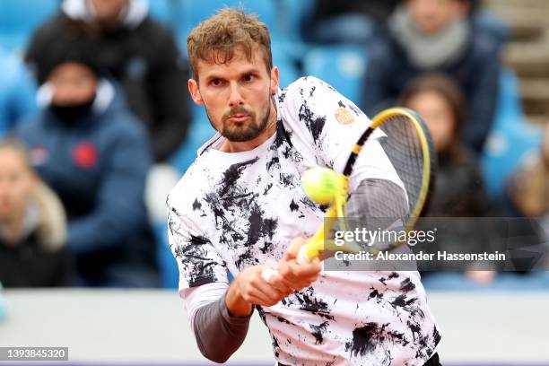 Oscar Otte of Germany plays a back hand during his first round match against Marko Topo of Serbia on day four of the BMW Open by American Express at...