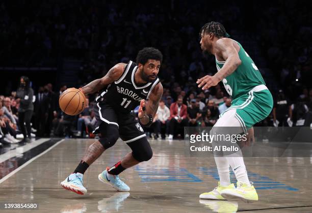 Kyrie Irving of the Brooklyn Nets drives against Marcus Smart of the Boston Celtics during Game Three of the Eastern Conference First Round NBA...
